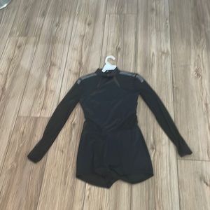 black unitard with mesh cut outs and mesh sleeves
